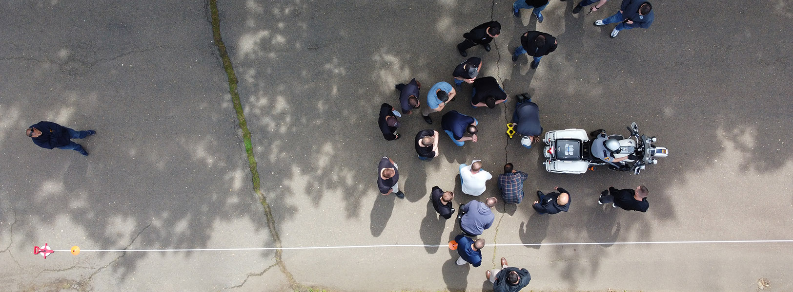 Aerial view of group attending motorcycle demonstration