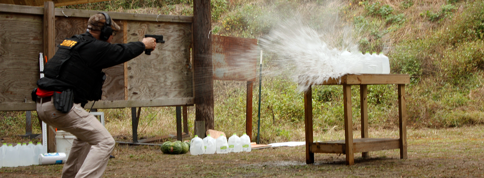 Class exercise shooting gallon bottles of water