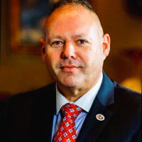 Professional headshot of Tony Anderson, keynote presenter at IPTM