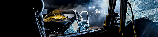 vehicle crash scene at nighttime